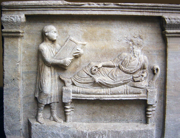 Relief of a slave tending to his master 