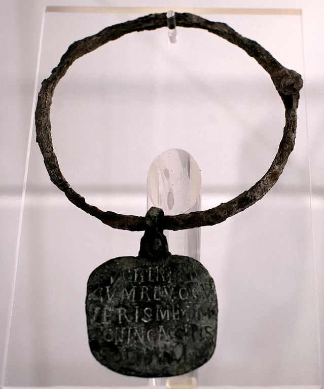 A photo of a slave collar explaining that whoever returns this runaway slave will get a reward. 